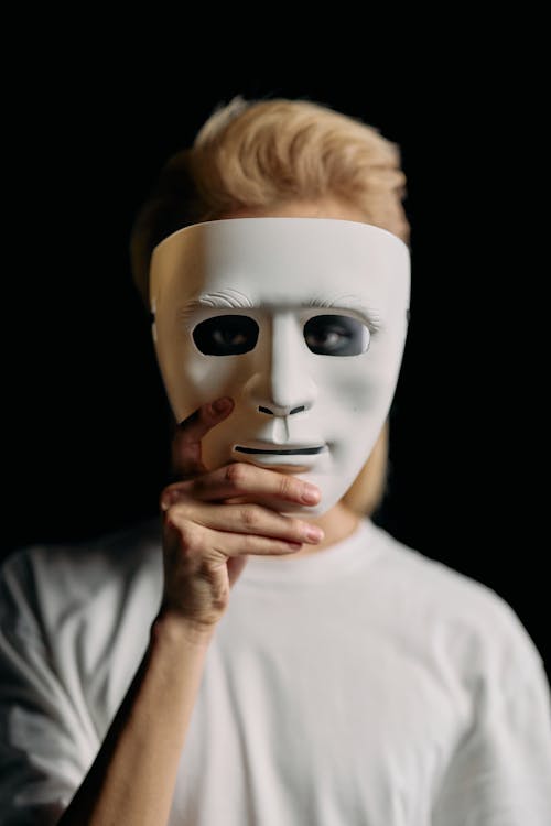 Photo of Man Looking Through a Face Mask