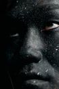 Close Up Photo of Man with Black Face Paint