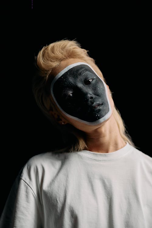 Half Face Photo of Man in Black Face Paint · Free Stock Photo