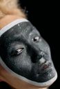 Close Up Photo of Man with Black Face Paint