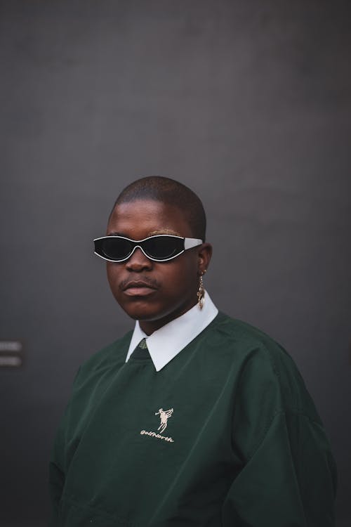 Free 
A Man Wearing a Green Sweater and Sunglasses Stock Photo