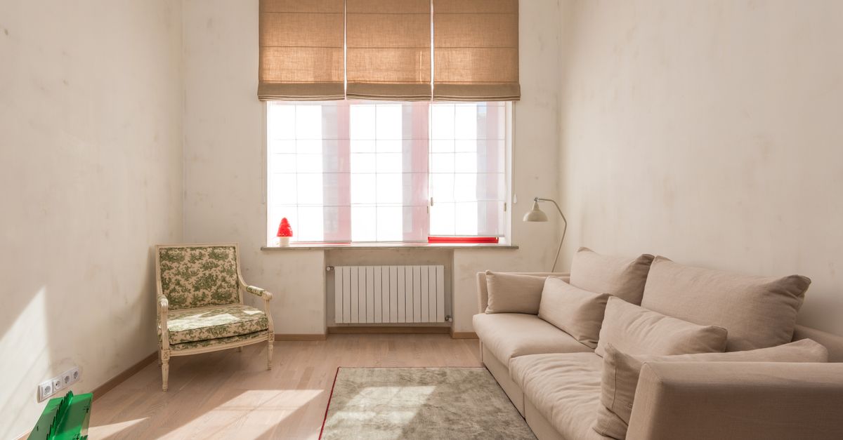 Bright, decluttered living room of a home being prepared for sale with neutral decor