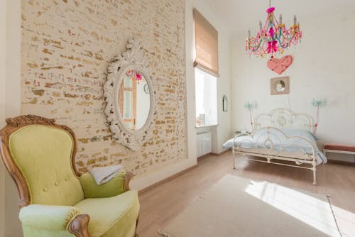 Chandelier and Bed in Room