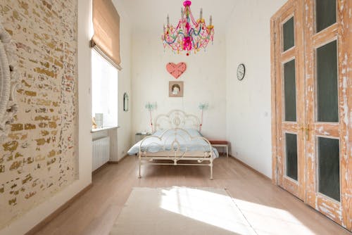 Bed and Chandelier in Room