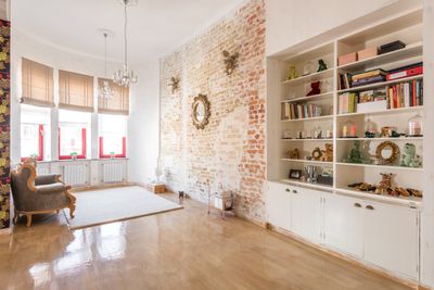 Spacious and bright loft with exposed brick and modern furnishings — photo by Max Vakhtbovych on Pexels