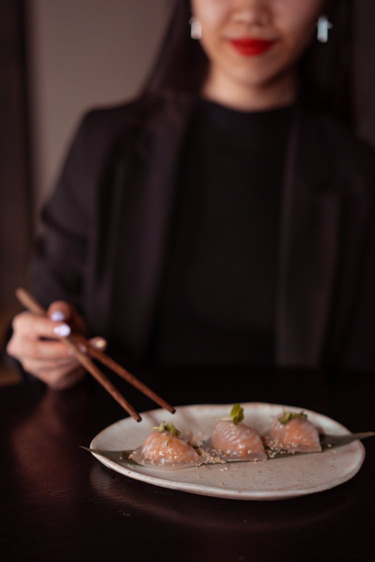 
A Woman Eating Dumplings