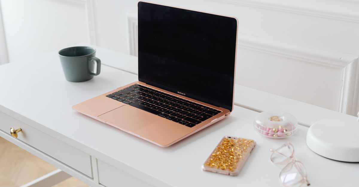 Macbook on White Wooden Table · Free Stock Photo