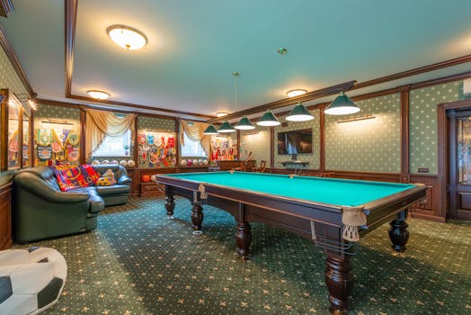 Elegant billiard room with vibrant decor and classic furnishings.