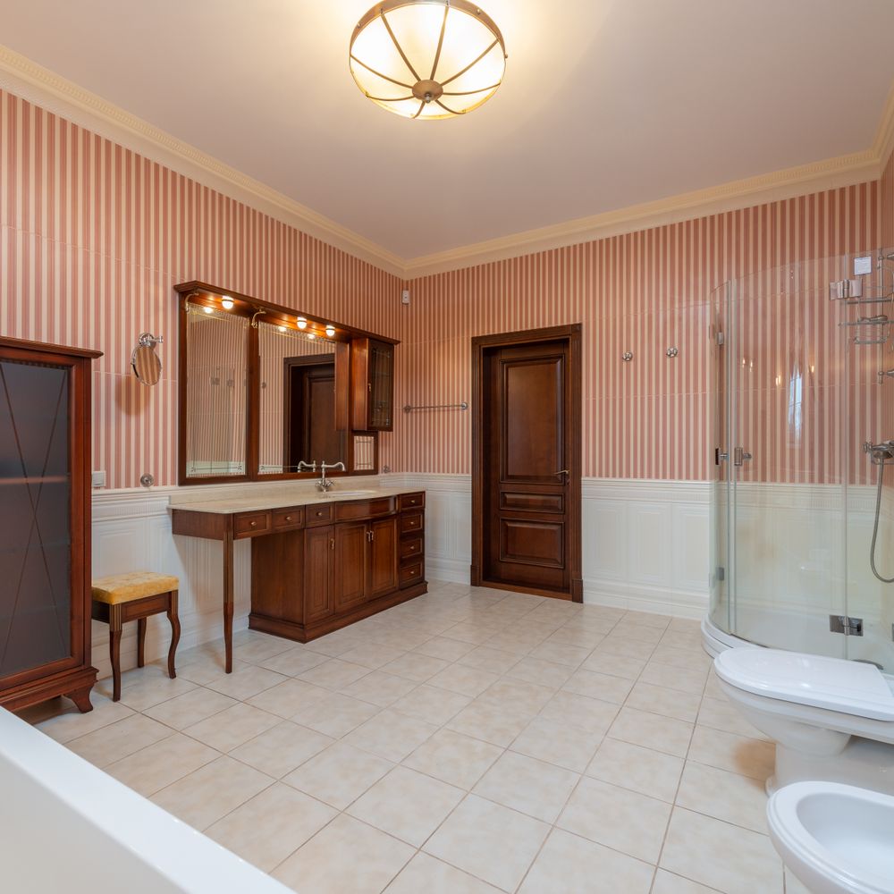 Wallpapering in Raynes Park — woodwork brushed to a crisp, smooth line