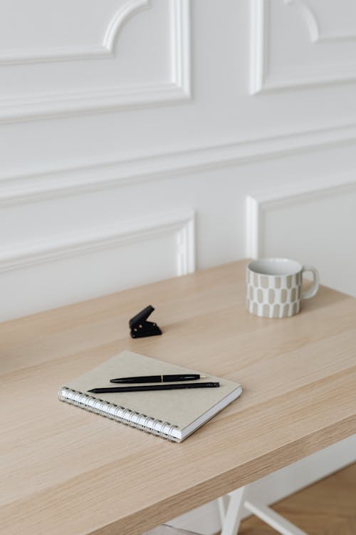 Free A Notebook and Pen on the Table  Stock Photo