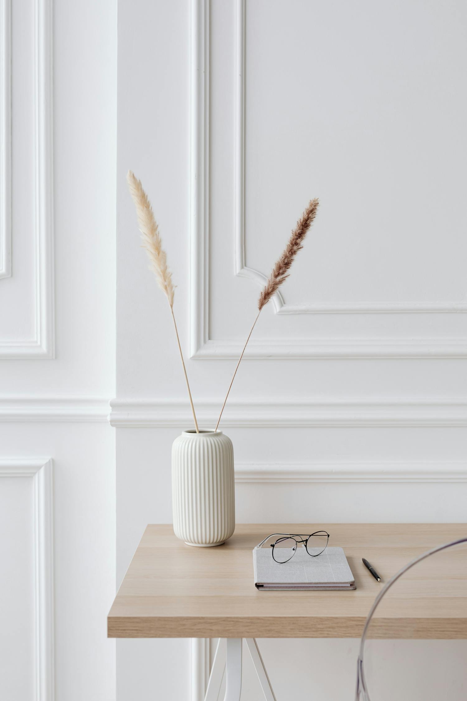 Minimalist workspace featuring eyewear on natural materials showcasing AI helper technology