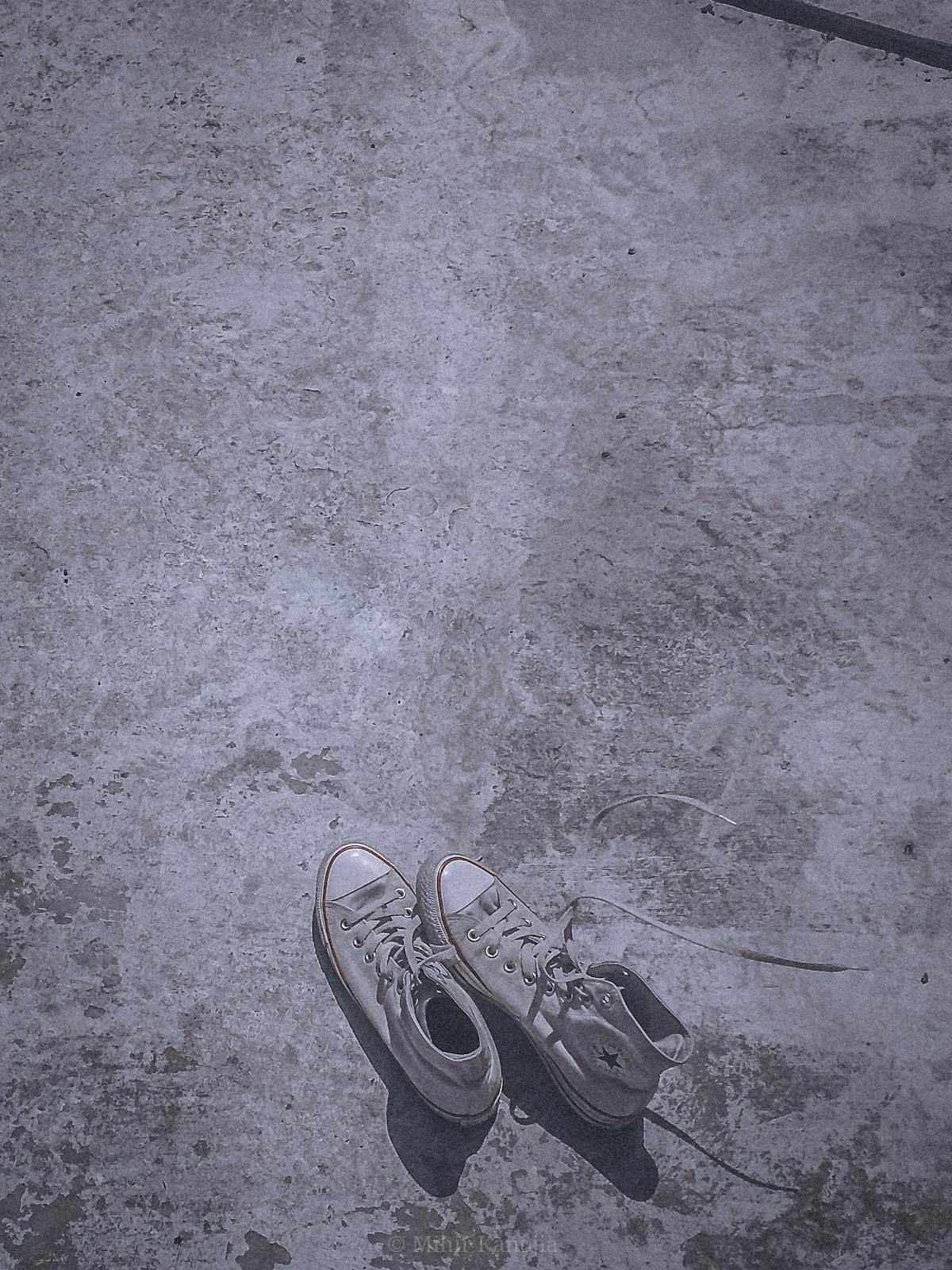 Minimalist bedroom with soft light and neatly made bed, evoking calm and order