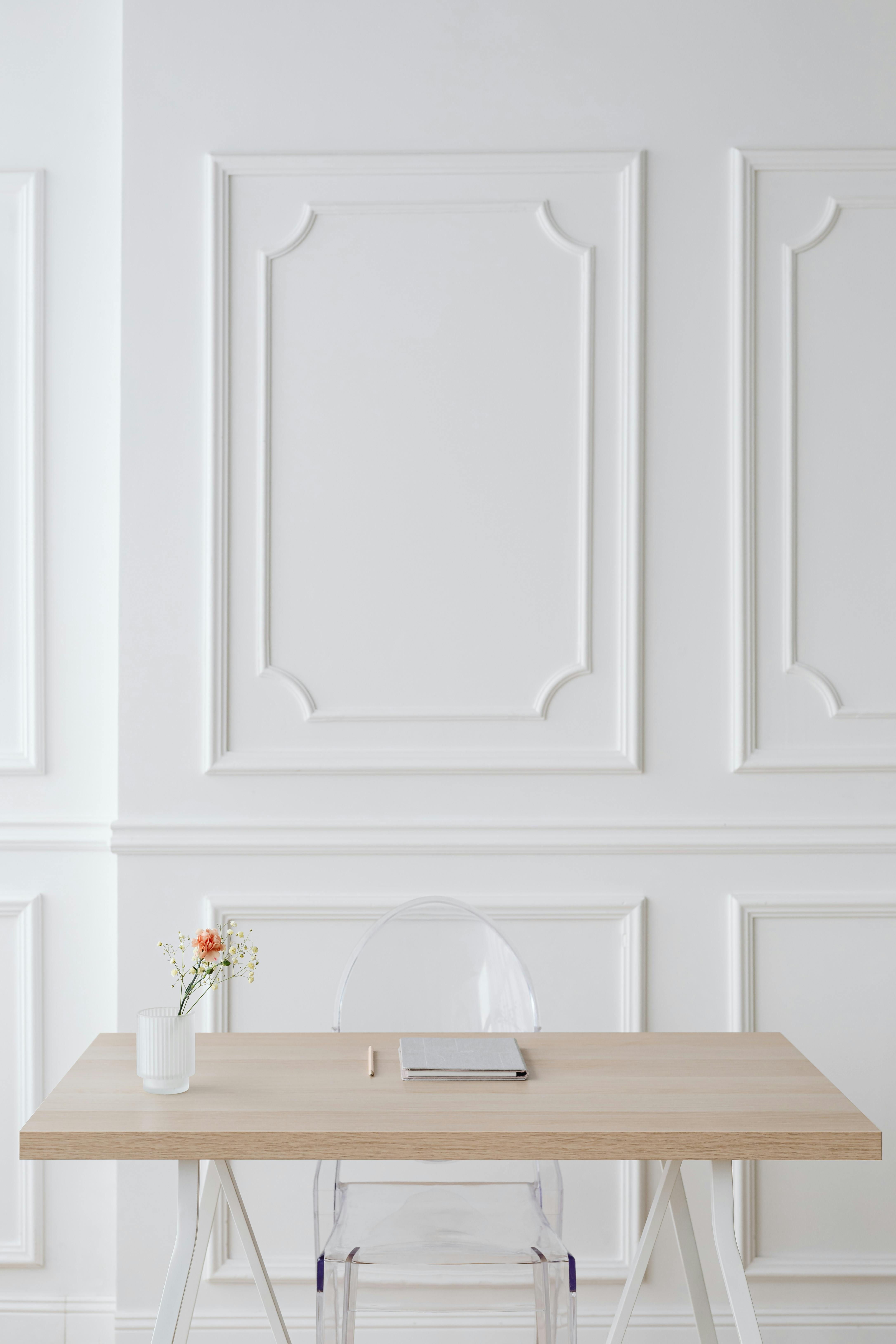 Brown Wooden Table Near White Wall · Free Stock Photo