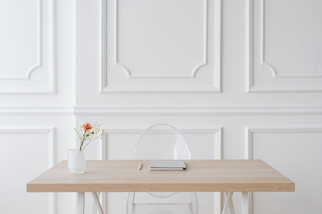 Decorative rectangular wall molding above a dining table