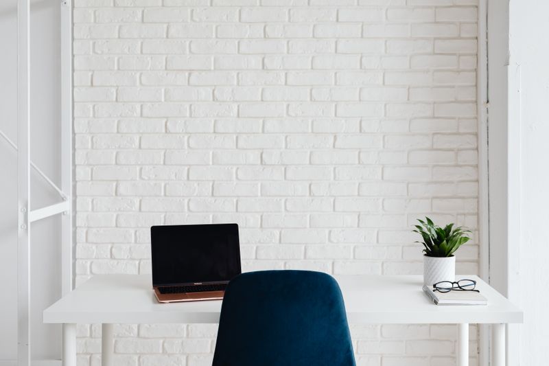 macrame wall hanging behind a home office desk