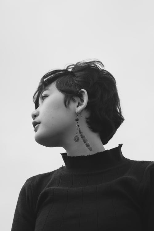 Grayscale Photo of Woman With Short Hair and An Earring