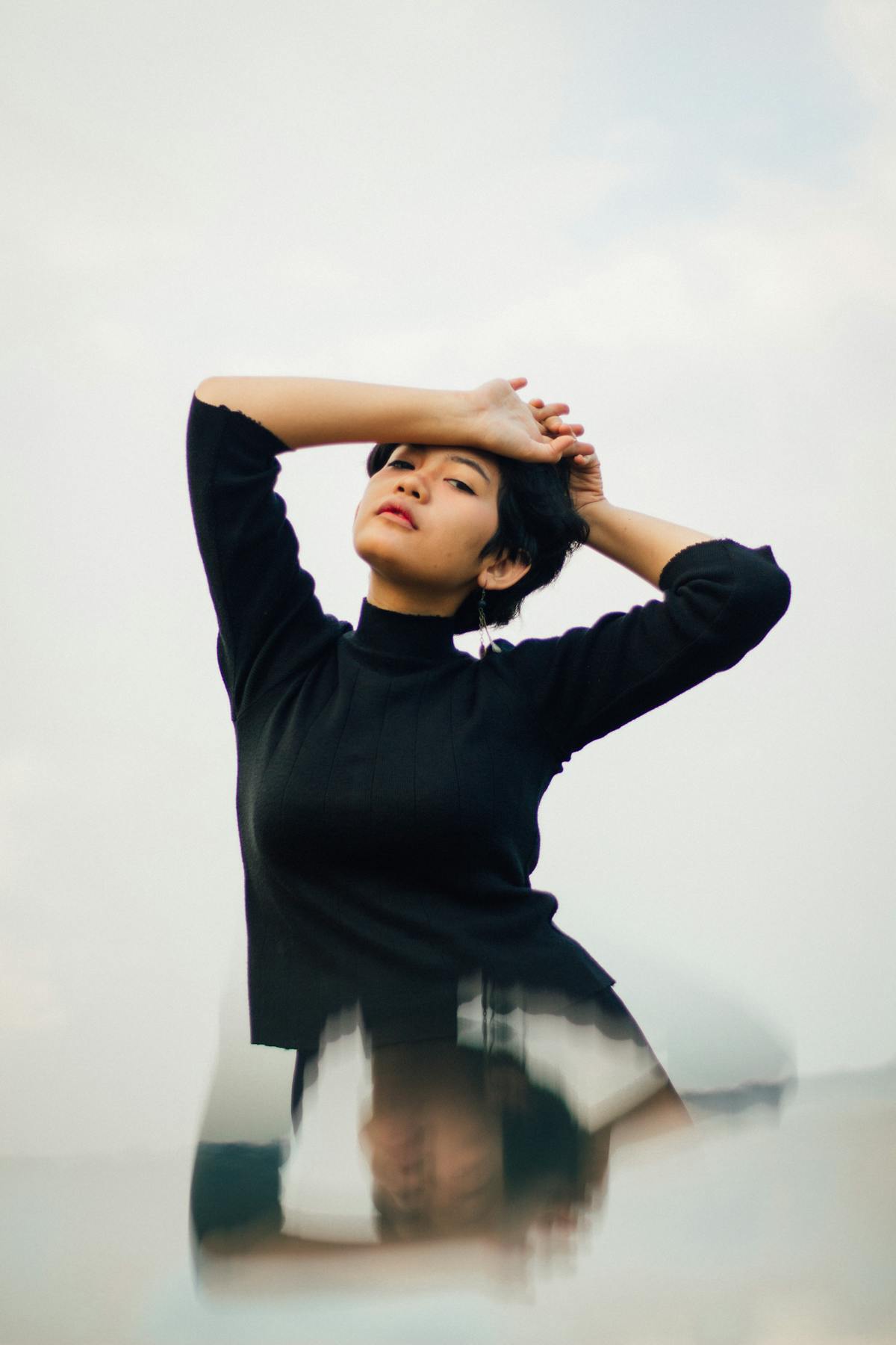 Minimal white desk with laptop, coffee, and tidy accessories reflecting clean girl desk setup