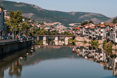 Free Picturesque landscape of Amasya, Turkey featuring riverside houses and mountains. Stock Photo