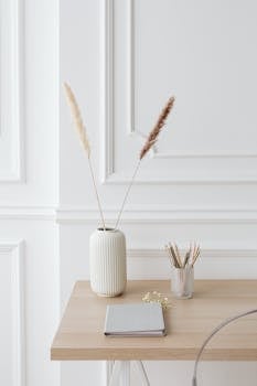 Minimalist desk setup with elegant decor and stationery for a clean and serene workspace.