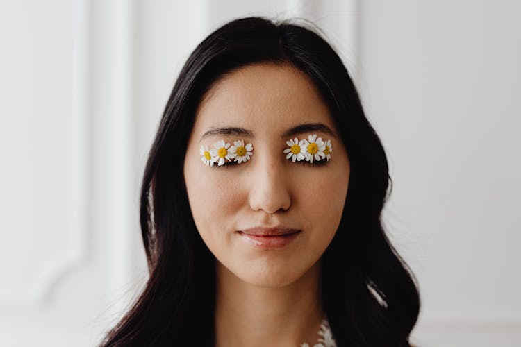 Woman With Daisies On Eyes