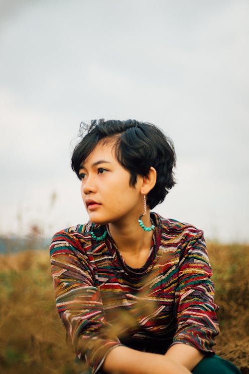 

A Woman with Short Hair Wearing Earrings