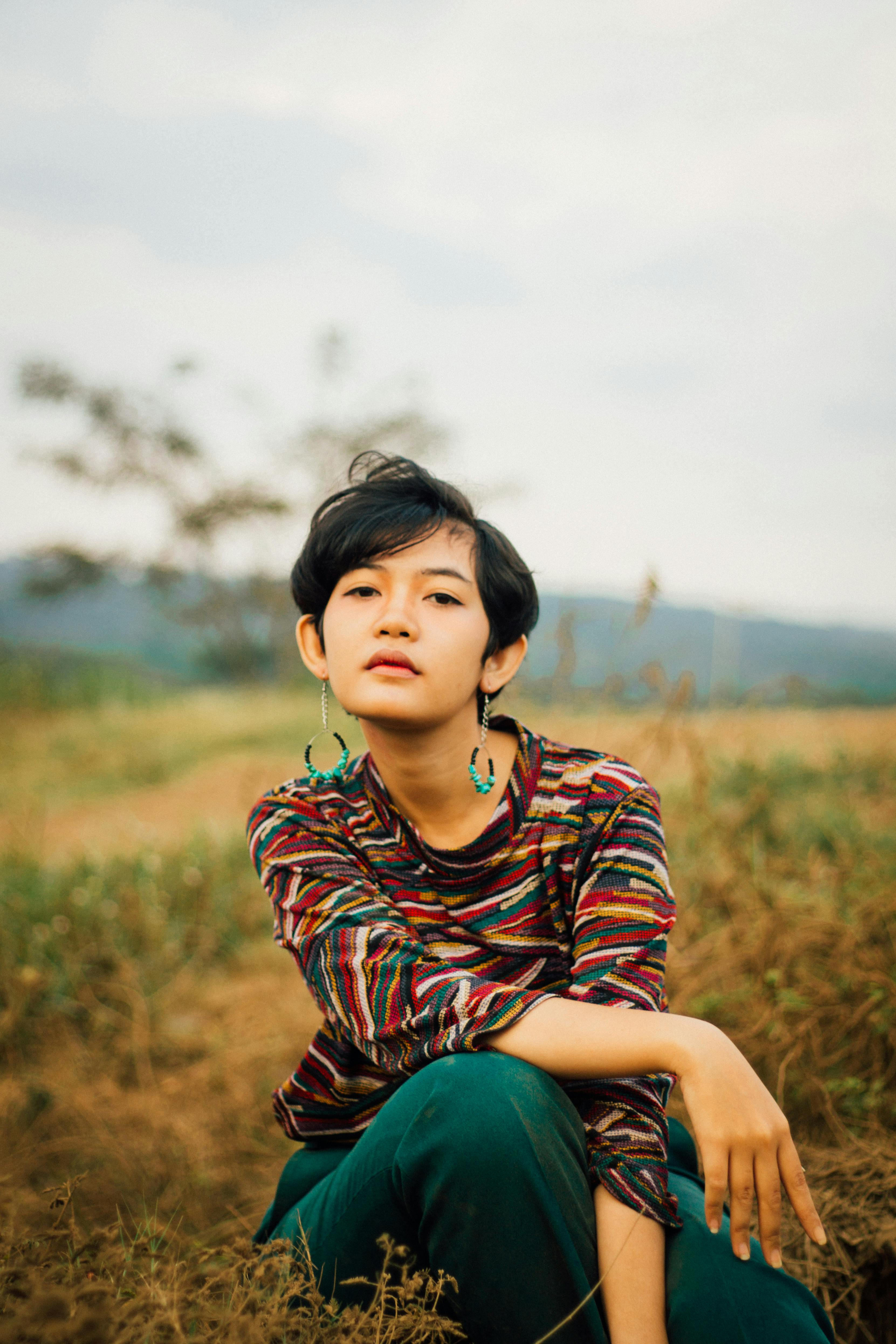 A Woman with Short Hair Wearing Earrings · Free Stock Photo