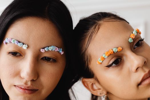 Close-Up Shot of Two Girls with Flower Brows