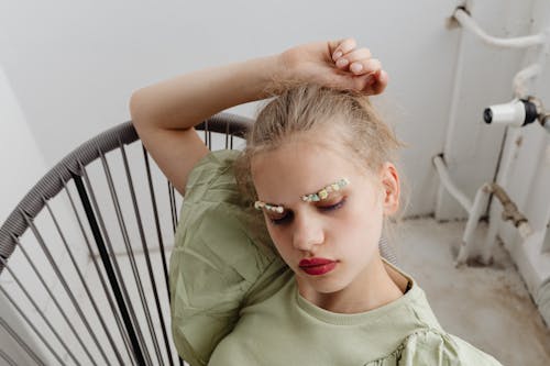 Girl With Colorful Eyebrows and Red Lipstick