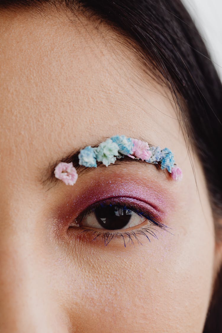 Close-Up Photo Of A Person With Glittery Eye Makeup