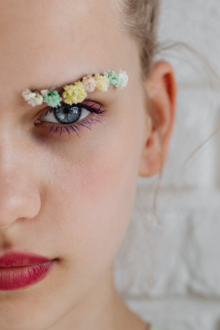 Close-Up Photo Of Woman With Eye Makeup And Red Lips