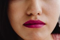 Close-Up Photo of a Person Wearing a Mauve Lipstick