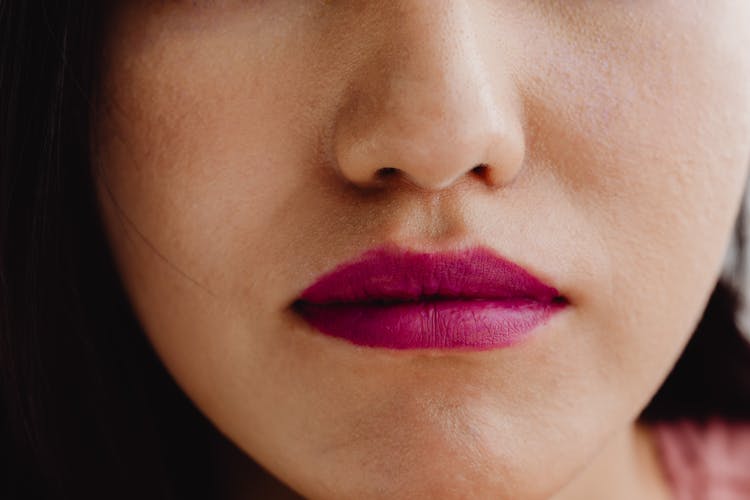 Close-Up Photo Of A Person Wearing A Mauve Lipstick