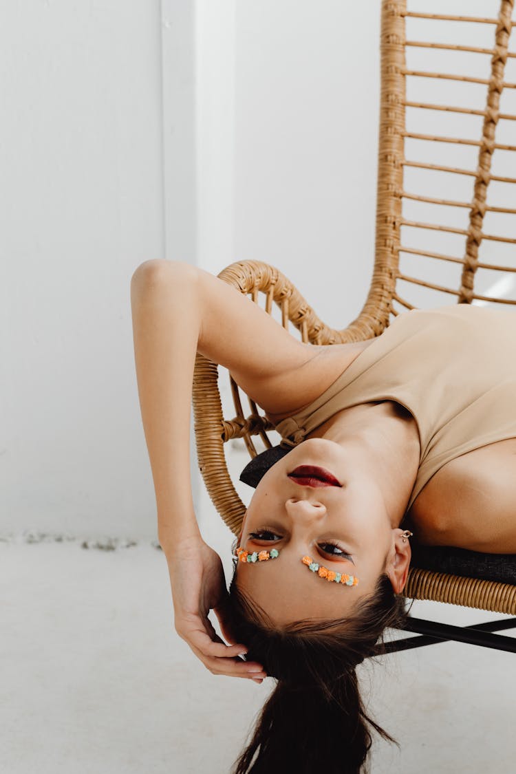 A Woman With Flower Brows Lying Down