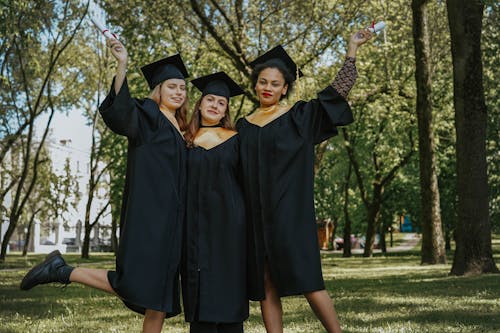 Free Women Wearing Graduation Gowns Stock Photo