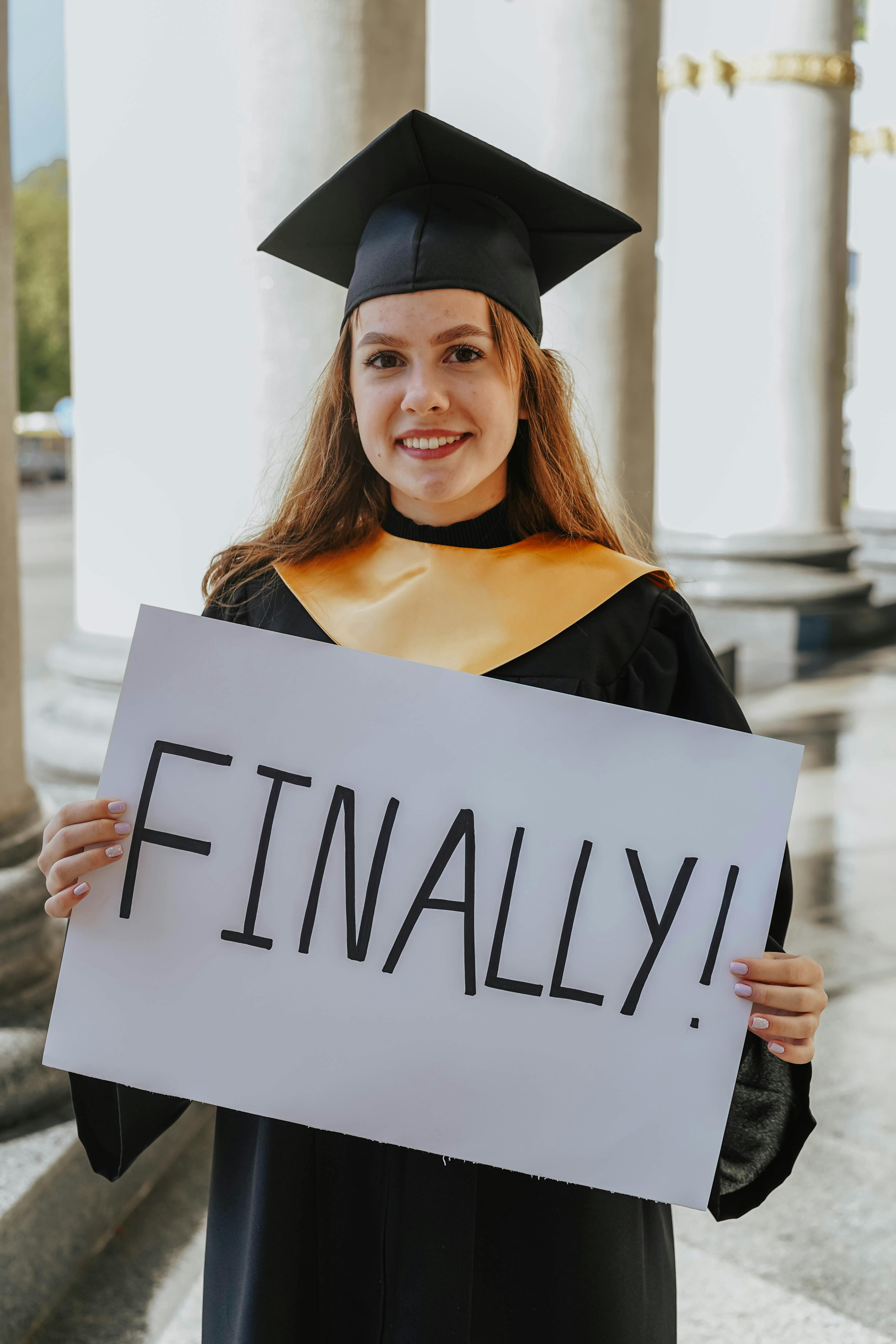 Female College Graduate in Cap and Gown Stock Photo - Image of