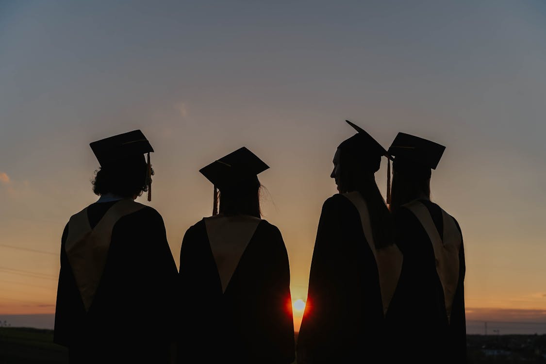 Silhouette of People Wearing Graduation Gown