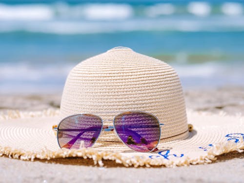 Free Sunglasses on Top of a Hat Stock Photo
