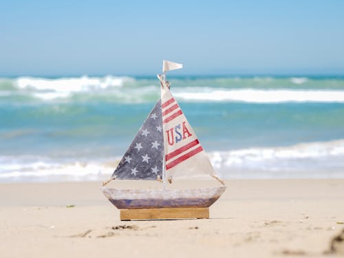 A Mini Sailboat on Seashore