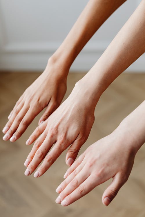 Free People's Hands with Different Shades of Skin Color Stock Photo