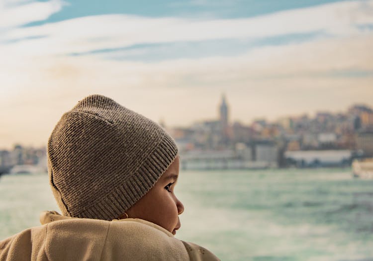 Side View Of A Cute Baby Wearing Beanie 