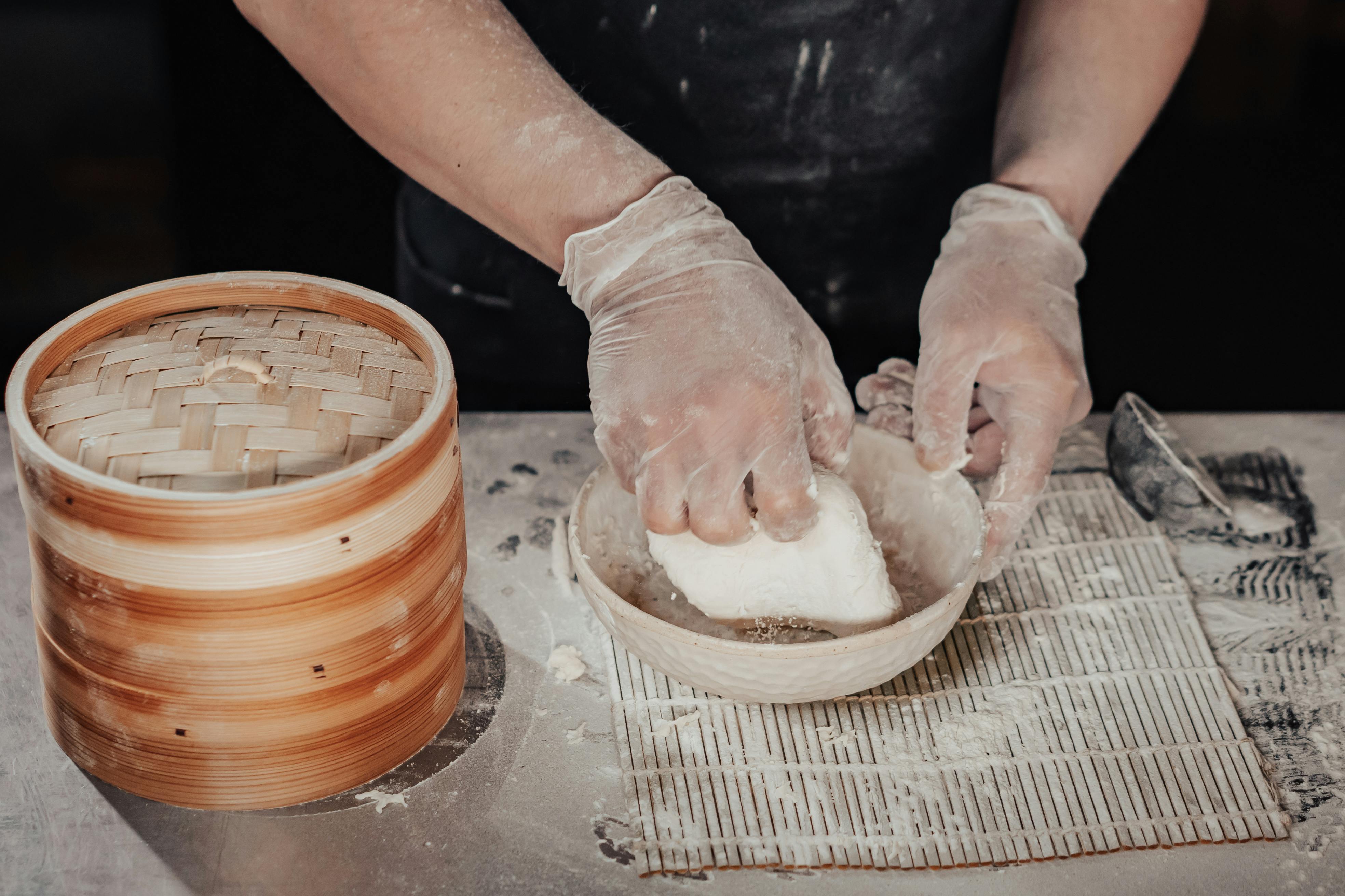 Person Holding Dough on White Bowl · Free Stock Photo