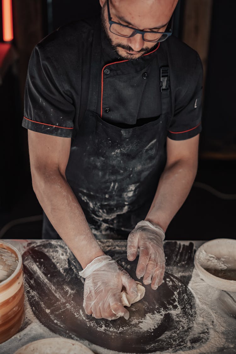 A Man Kneading Dough