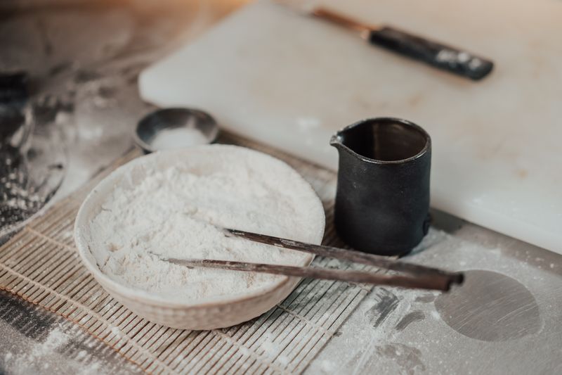 Flour in a ceramic bowl during baking preparation