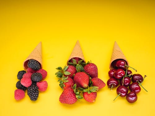 A Variety of Berries in Ice Cream Cones