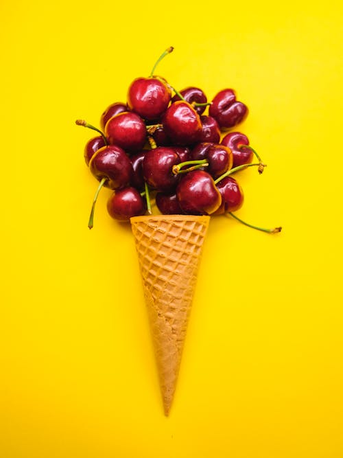 Ripe Cherries on Beside a Ice Cream Cone
