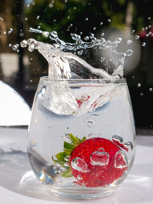 Free Clear Glass of Water with Strawberry Stock Photo
