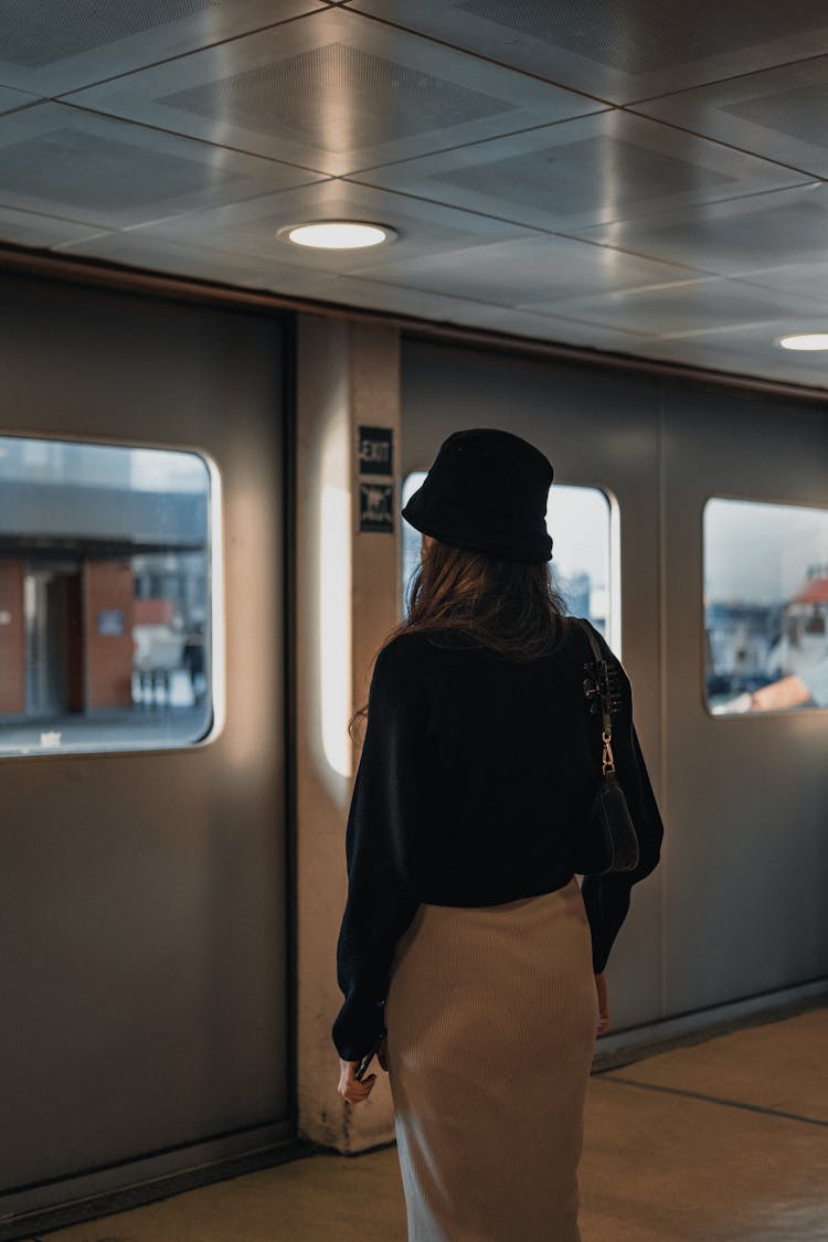 Unrecognizable Woman Standing Near Exit From Subway