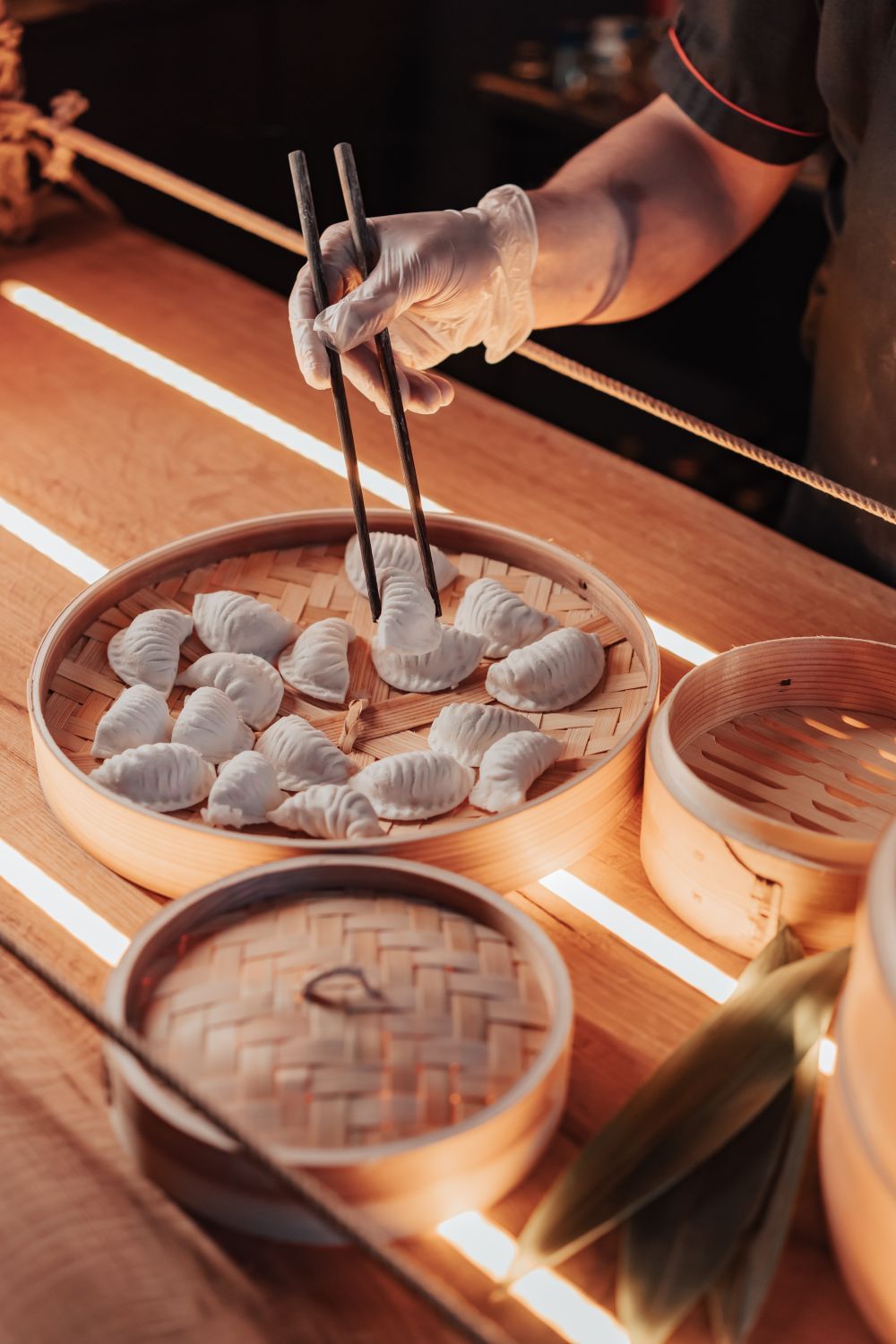 Cook Hand Injiry Cook Hand Holding Food on Tray with Chopsticks · Free Stock Photo