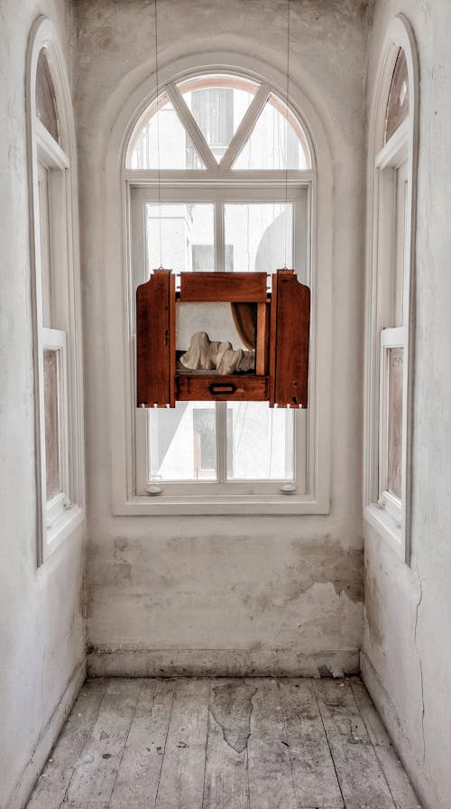 Brown Wooden Cabinet on Glass Window