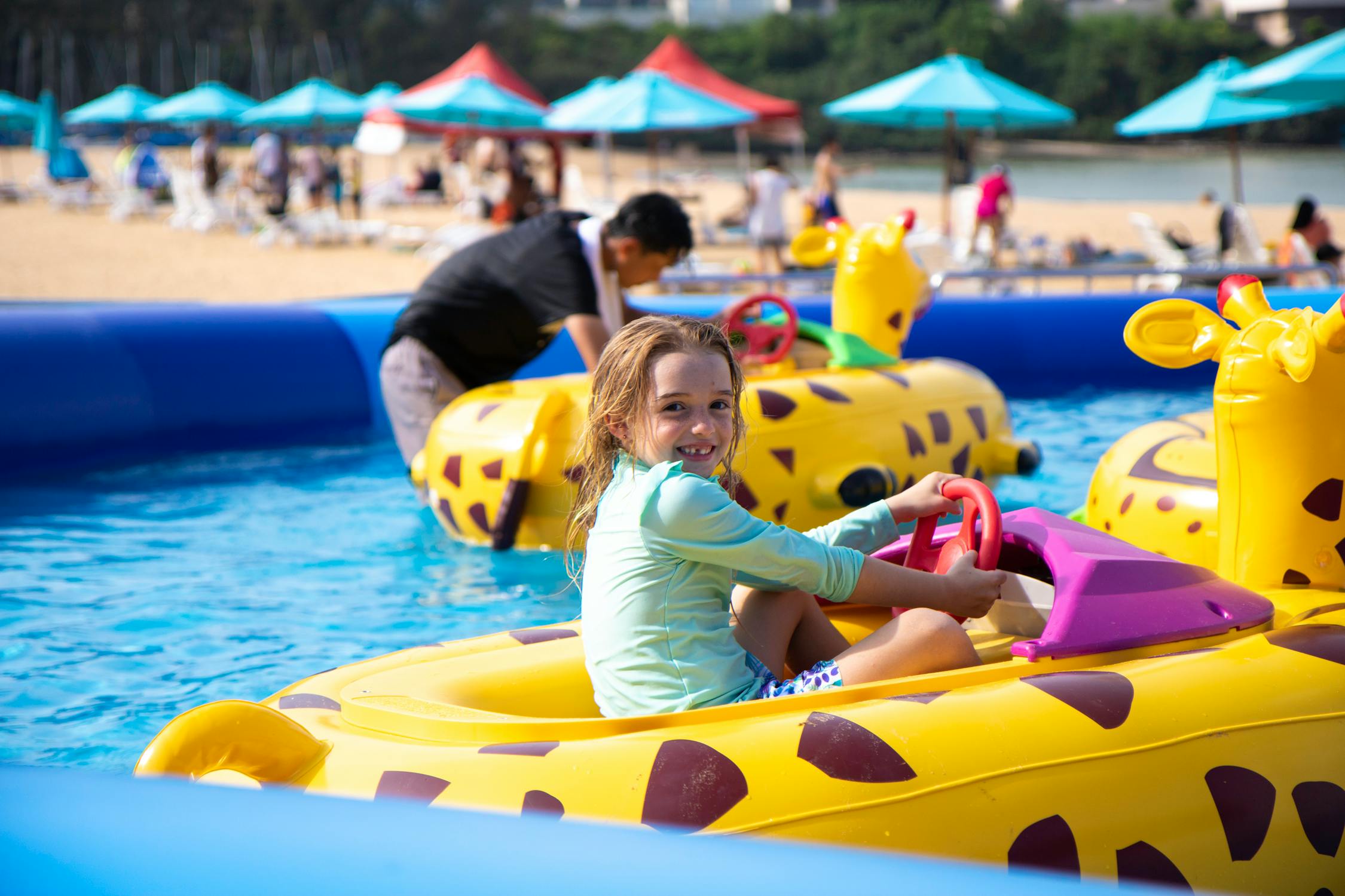 A Girl Riding a Floater on the Pool · Free Stock Photo
